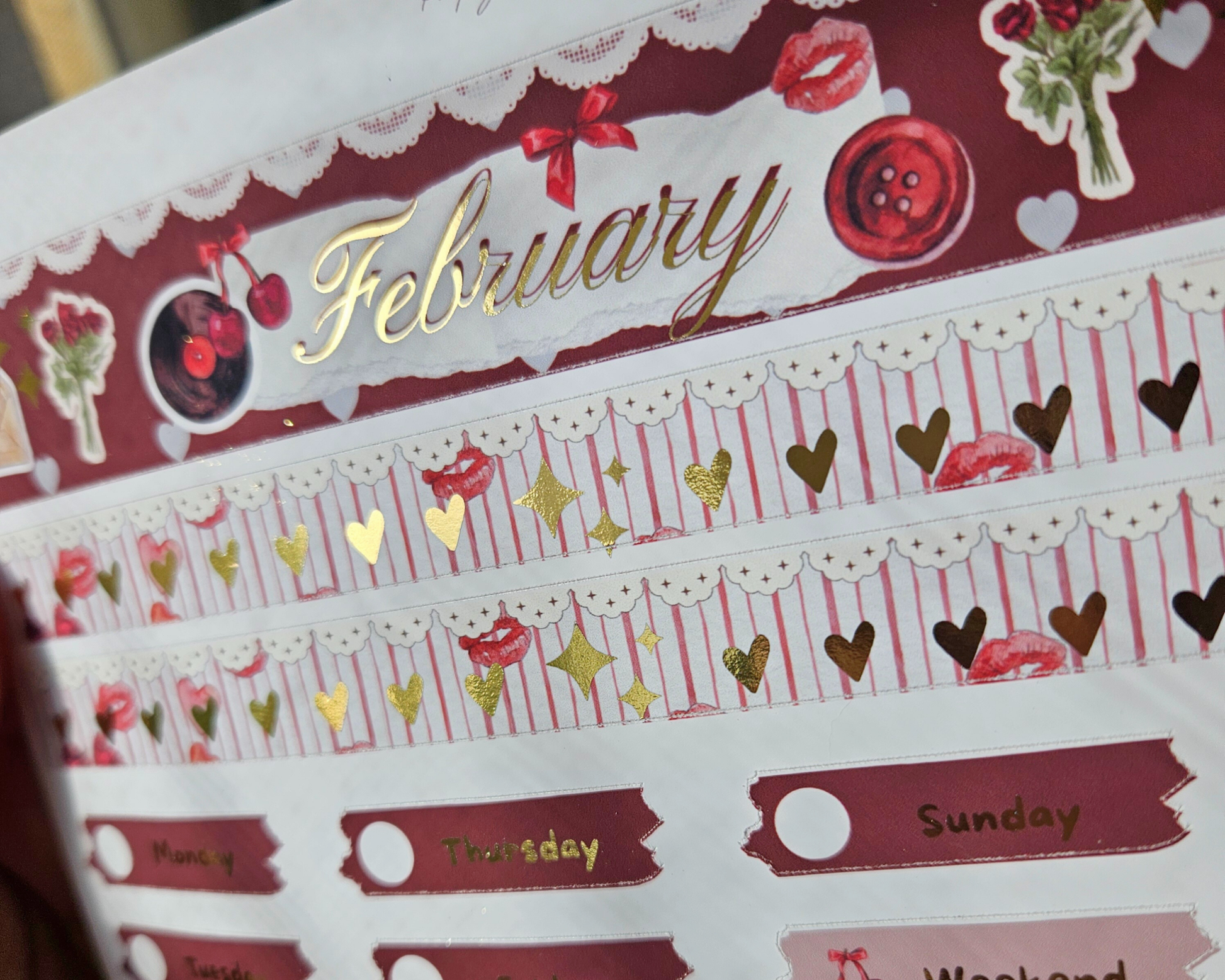 Decorative February calendar page with red and gold design elements.