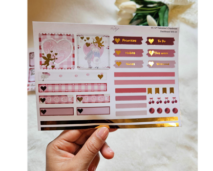Sheet of decorative planner stickers held by a hand with a soft background