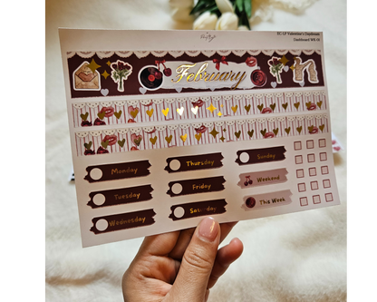 Sheet of decorative stickers with February layout and various designs held by a hand.