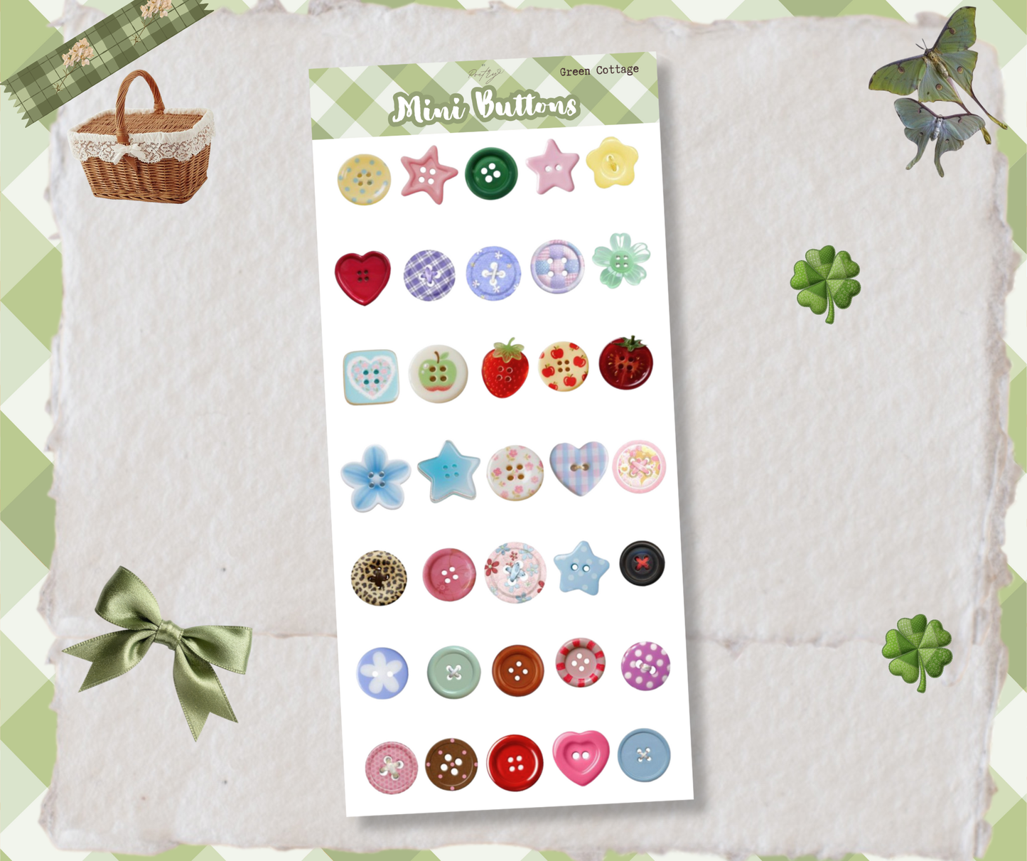 Sheet of colorful buttons with a green ribbon on a textured white surface.