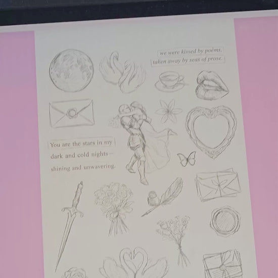 A video showing the process of drawing digital illustrations on a tablet using a stylus, which then transitions into a physical sticker sheet product. The 'A Warrior's Heart' themed design features a vintage and romantic fantasy style, depicting a knight in armor embracing his partner, two white swans, a golden sword, a red moon, roses, and a love letter with a wax seal. The video ends with a close-up view of the physical stickers on a table decorated with lace and white tulips